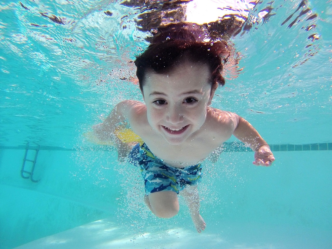 boy swimming underwater